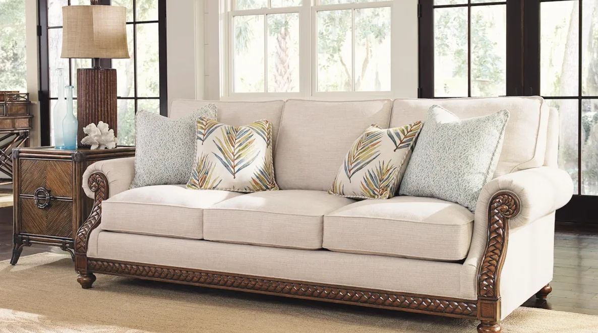 Light-colored fabric sofa with wood finishes in a living room setting. 
