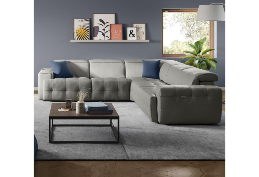 Gray leather sectional in a living room. 