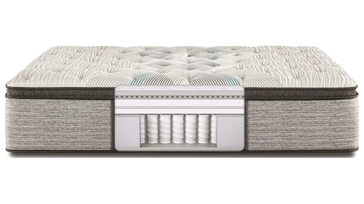 Mattress with cutaway view showing layers and covered coil springs.