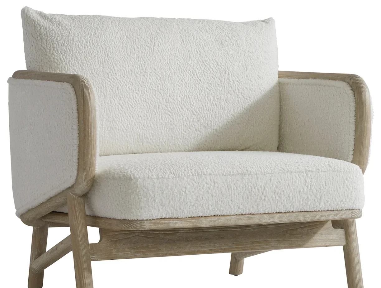 Textured fabric and wood easy chair. 