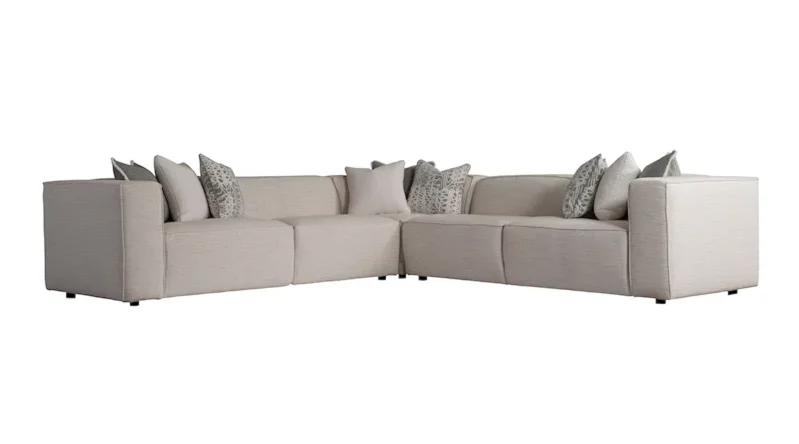 Beautiful gray symmetric minimalist sectional with throw pillows. 
