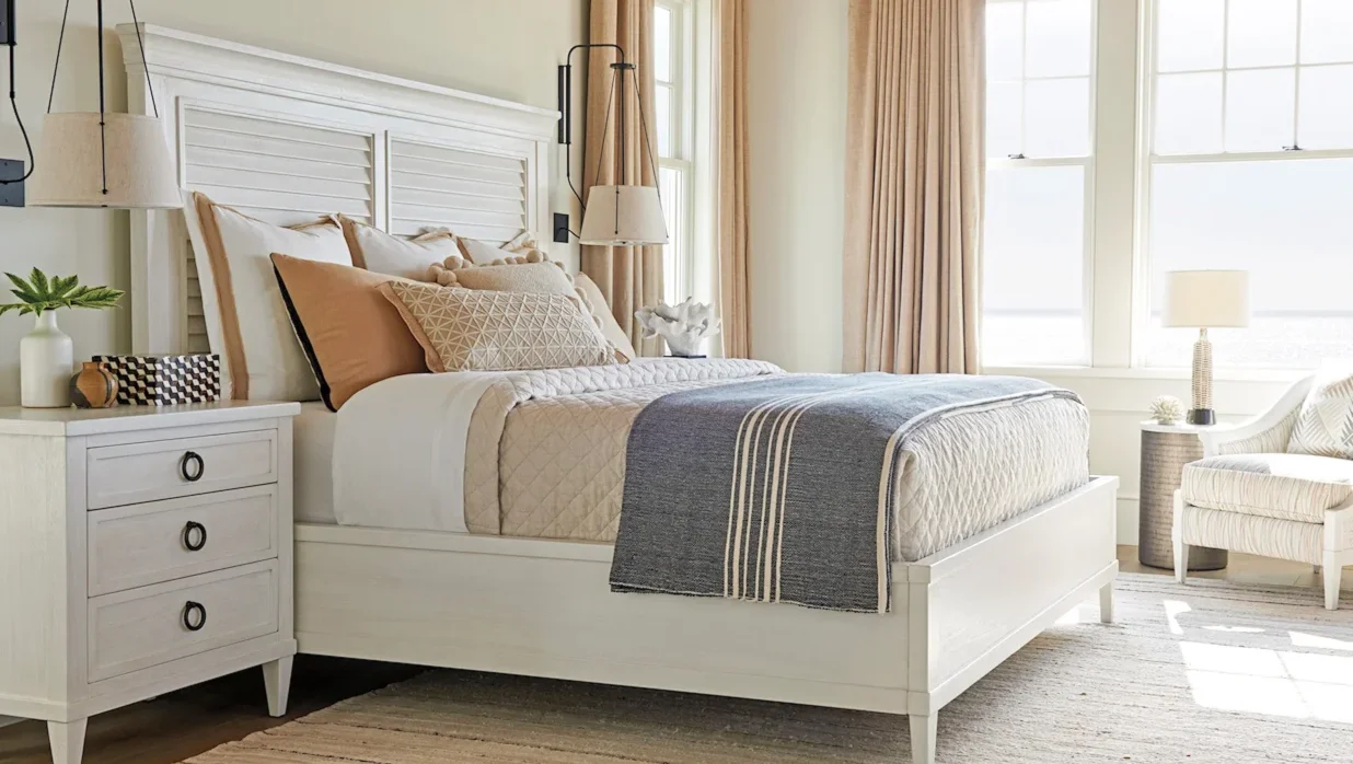 Picturesque modern farmhouse bedroom with a white louvered panel bed. 
