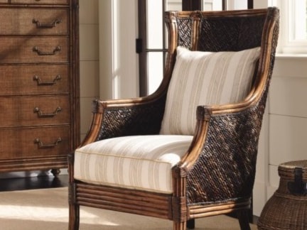 Beautiful rattan chair with vertically-striped cushions