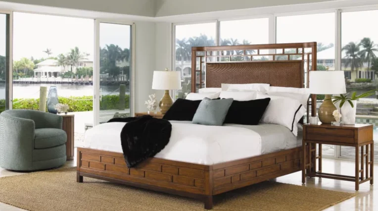 Rattan bed in the middle of a beautiful, Florida-styled panoramic bedroom. 