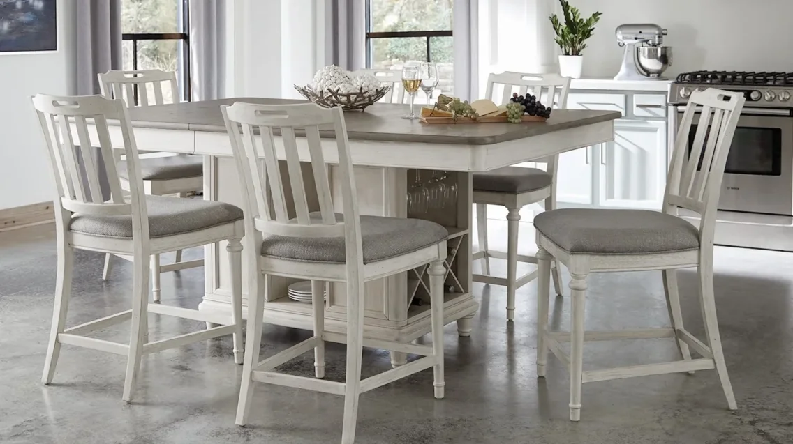 Two-toned whitewashed and wood table and chairs in a modern kitchen. 