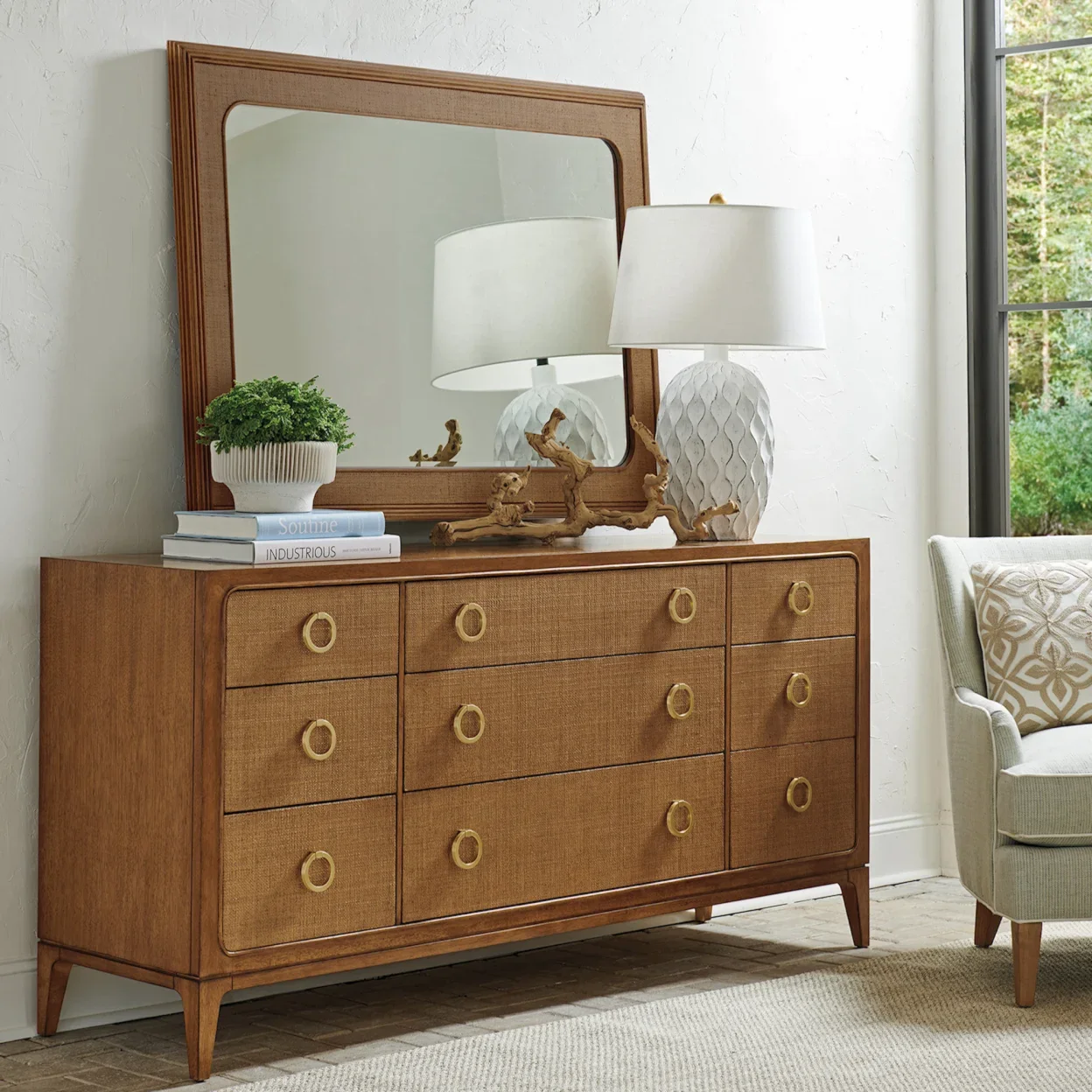 Stately dresser with rattan front and metal ring drawer pulls and matching mirror. 