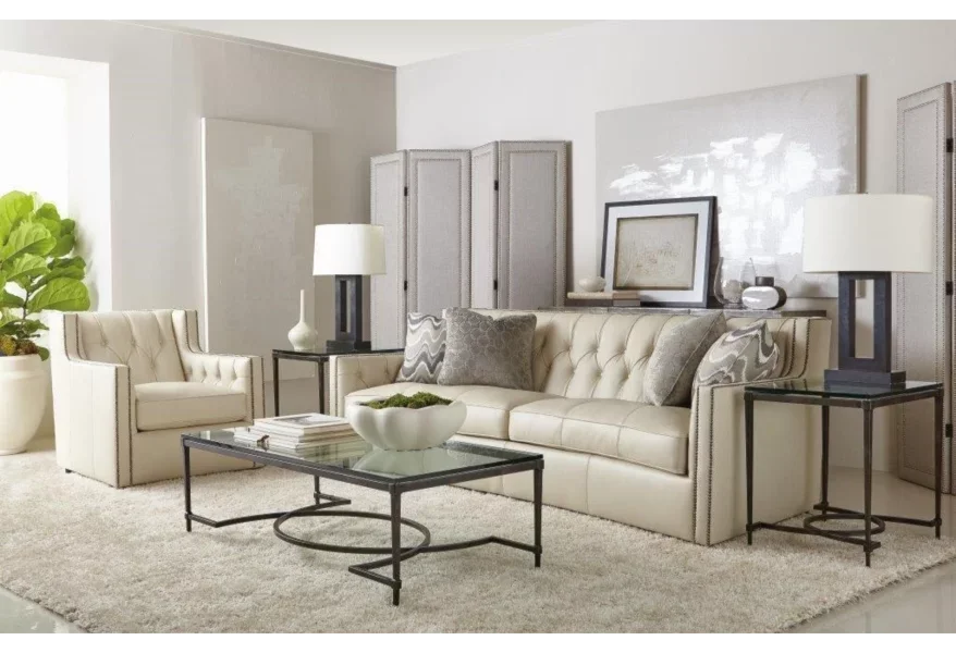 Living room with gorgeous Candace sofa in light-colored leather with matching swivel chair. 