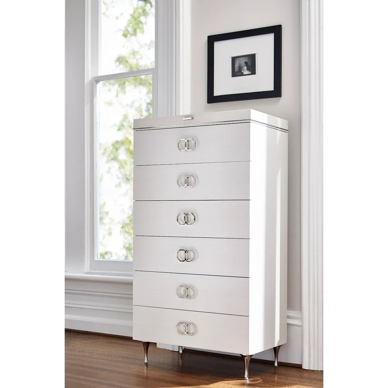 White chest on four metal tapered legs. 