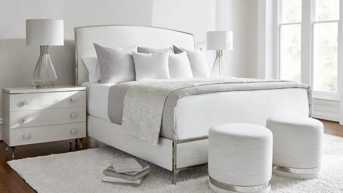 White upholstered bed in contemporary bedroom. 