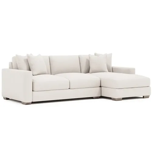white fabric sofa with chaise