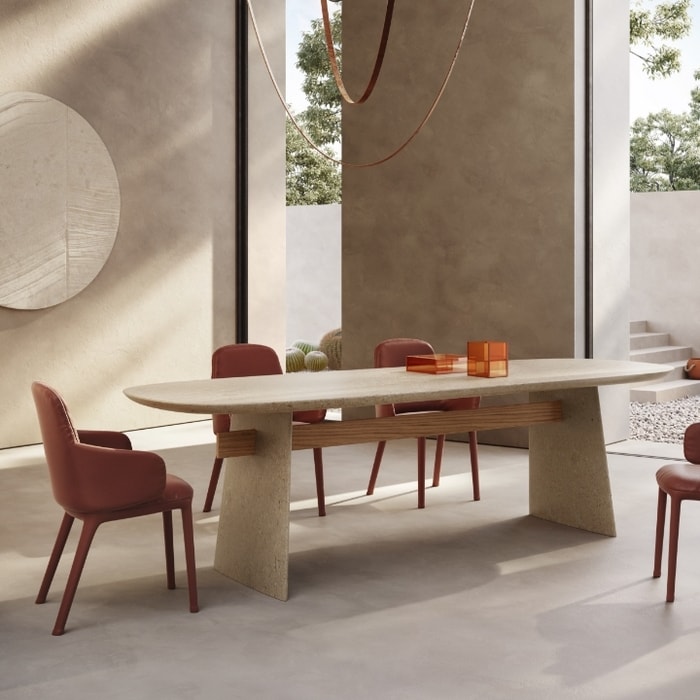 Dining room setting with dining table, four chairs and items on top