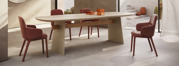 Dining room setting with dining table, four chairs and items on top
