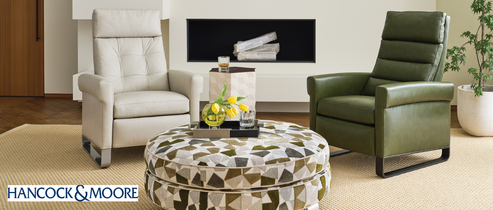 Hancock and Moore living room image with two reclining chairs, white and green, and a round ottoman in the center