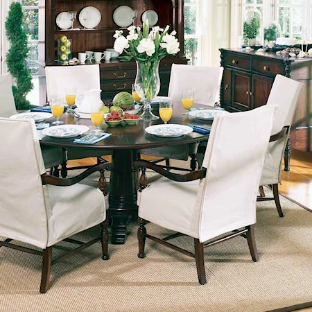 Seven Piece Round Pedestal Table and Slipcovered Upholstered Back Dining Arm Chair Set