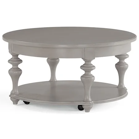 Traditional Round Cocktail Table with Turned Post Legs and Casters